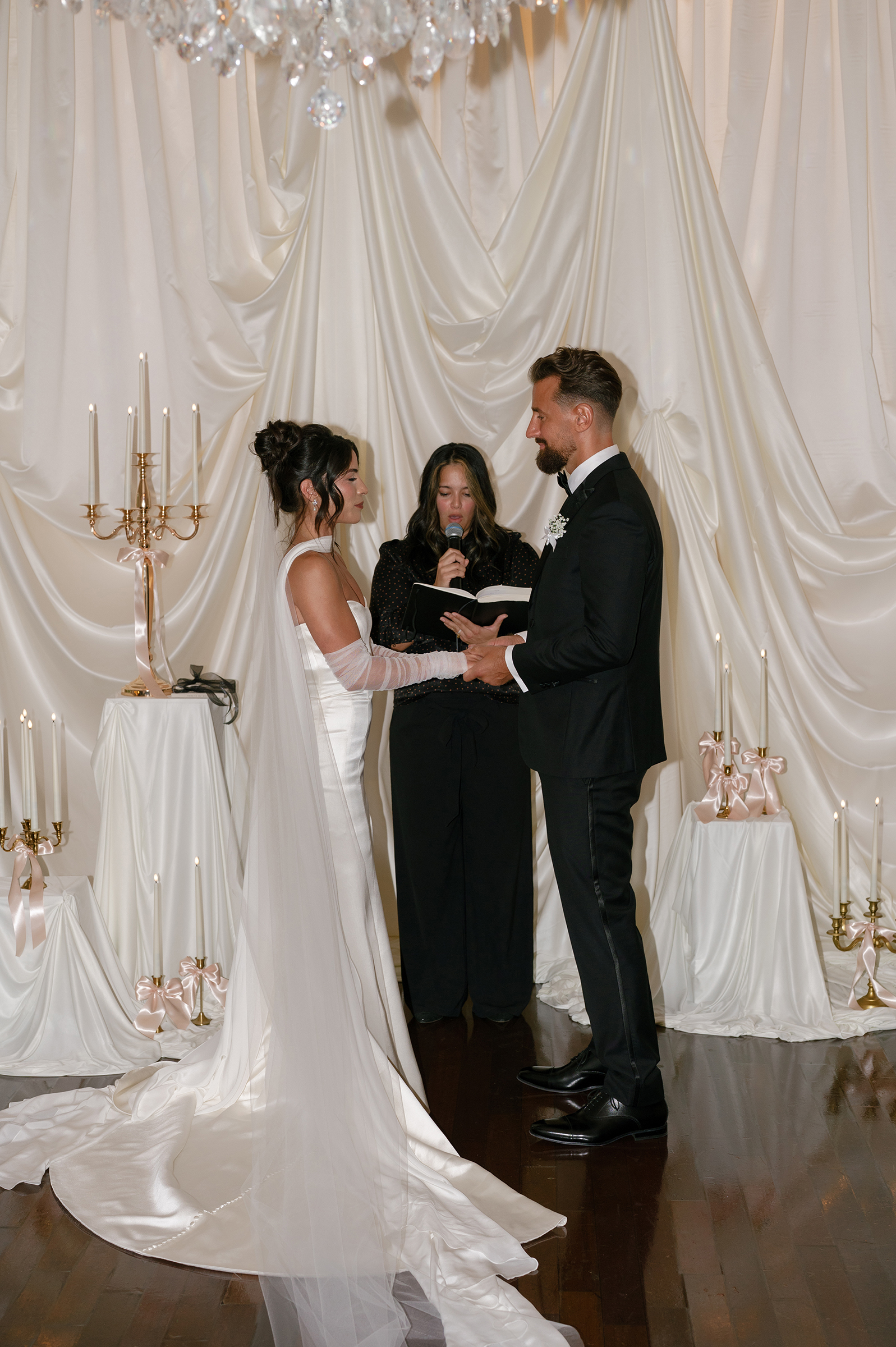 film picture of bride and groom at alter during wedding ceremony
