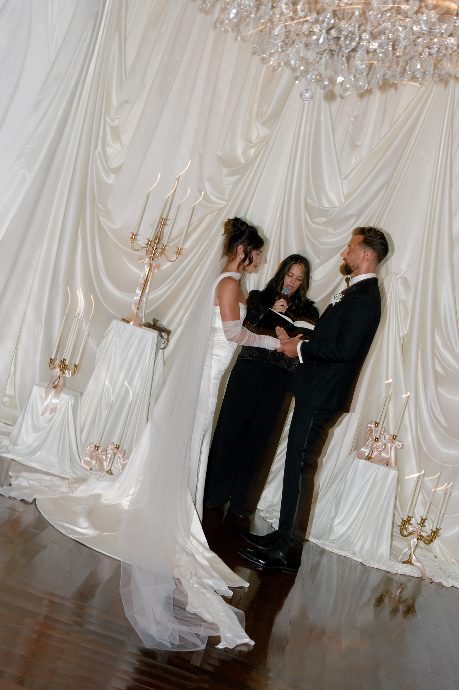 film picture of bride and groom at alter during wedding ceremony