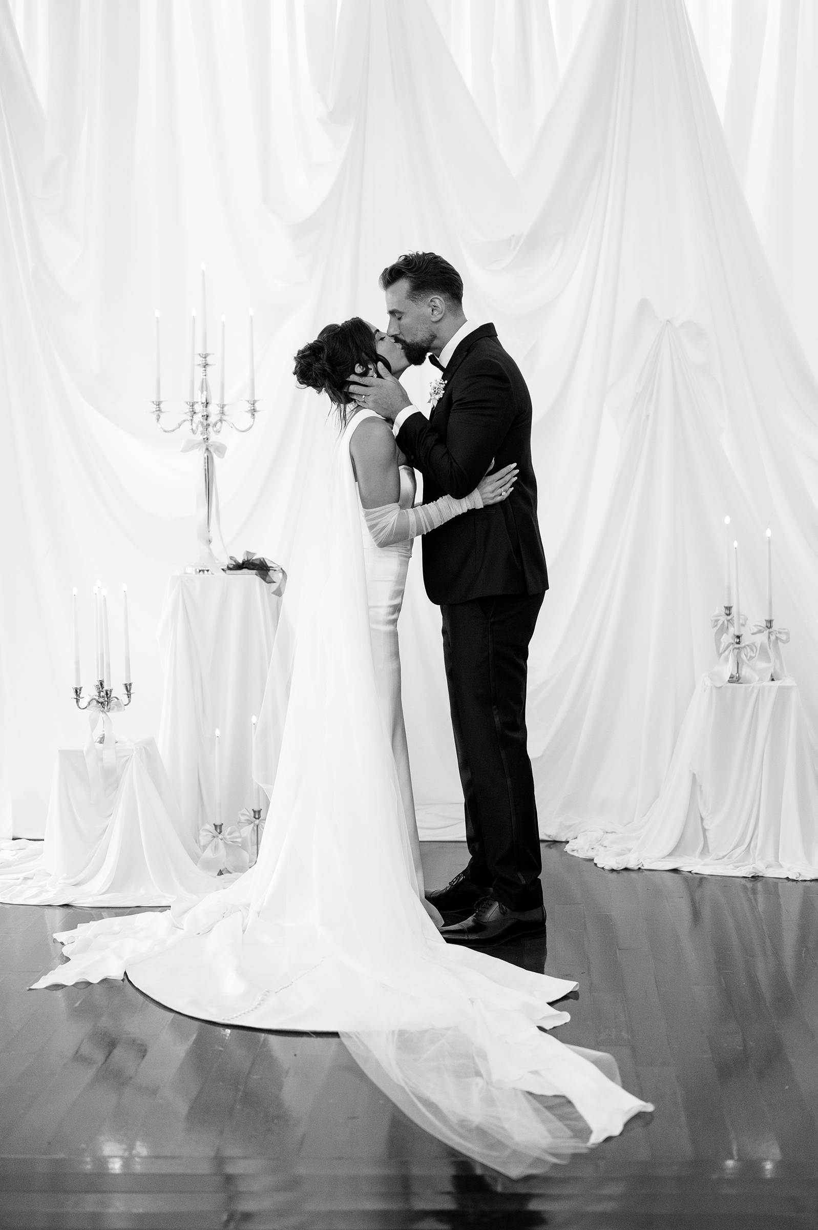 black and white picture of bride and groom during wedding ceremony
