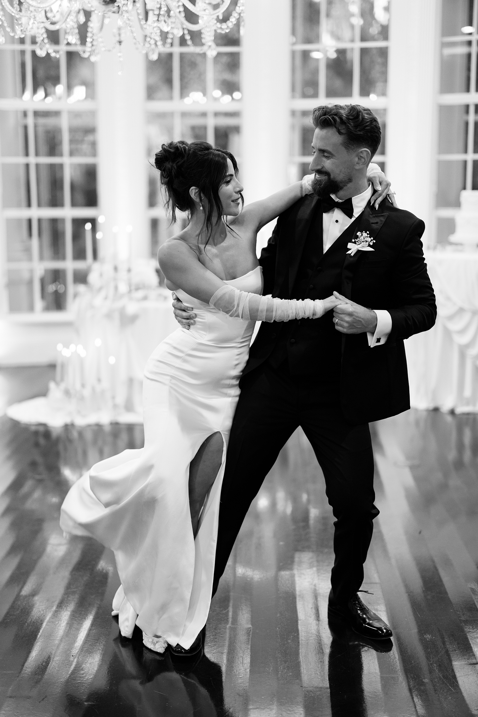 black and white picture of bride and groom's first dance