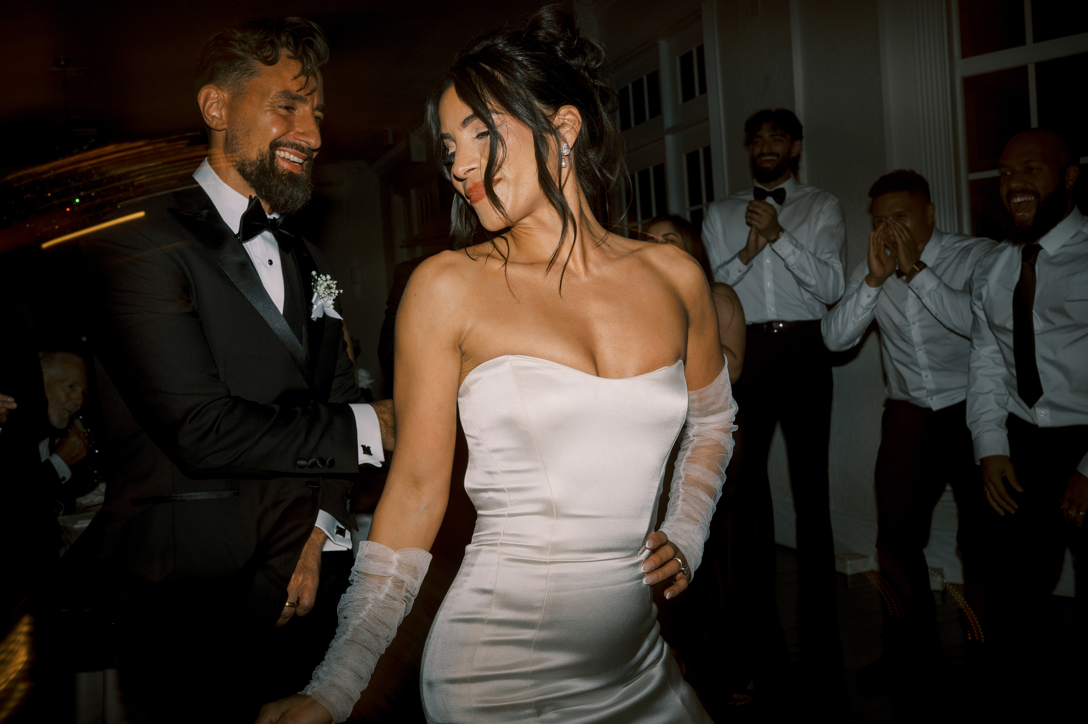 film picture of bride and groom dancing during wedding reception