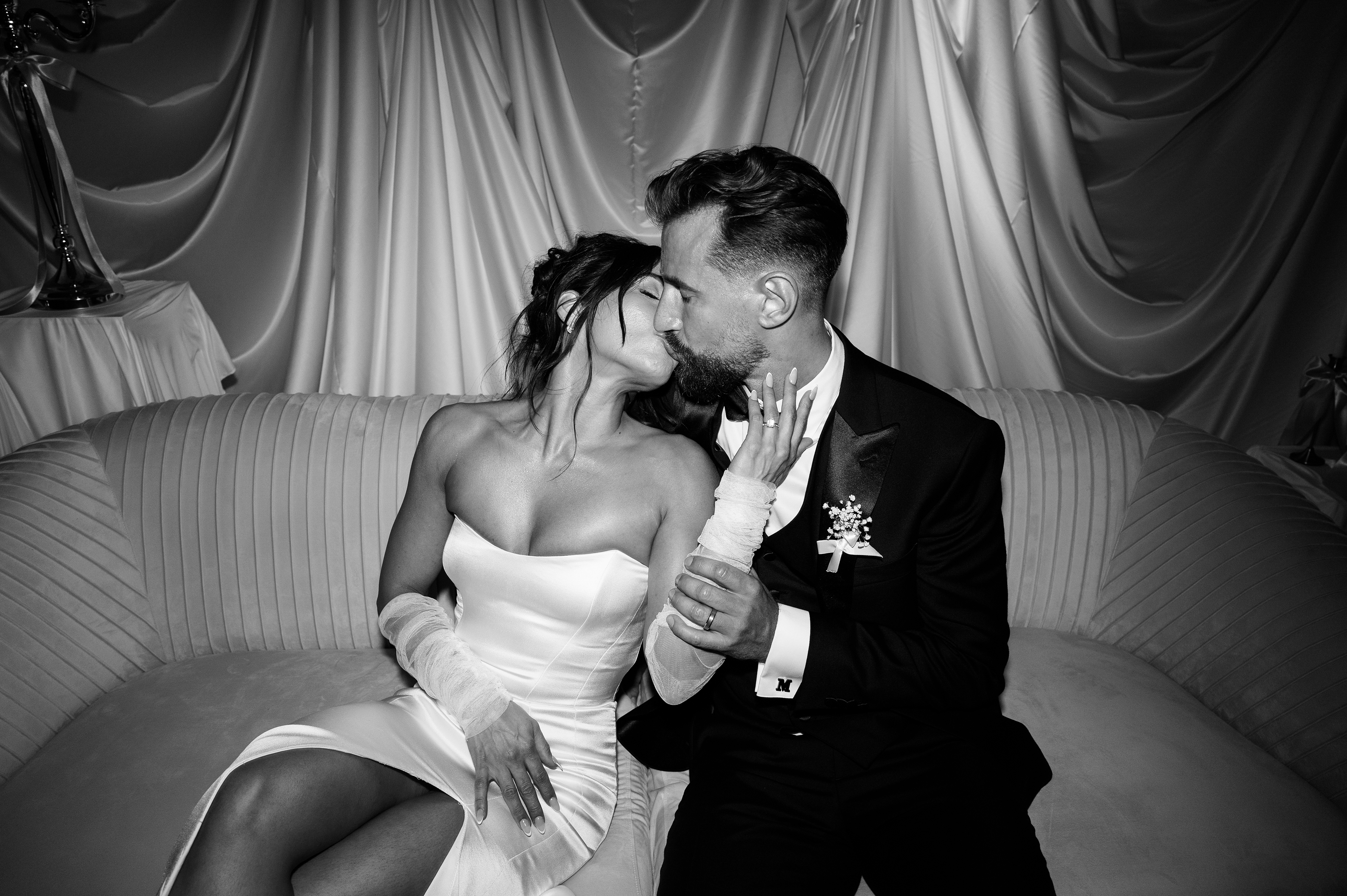 black and white picture of bride and groom during wedding reception