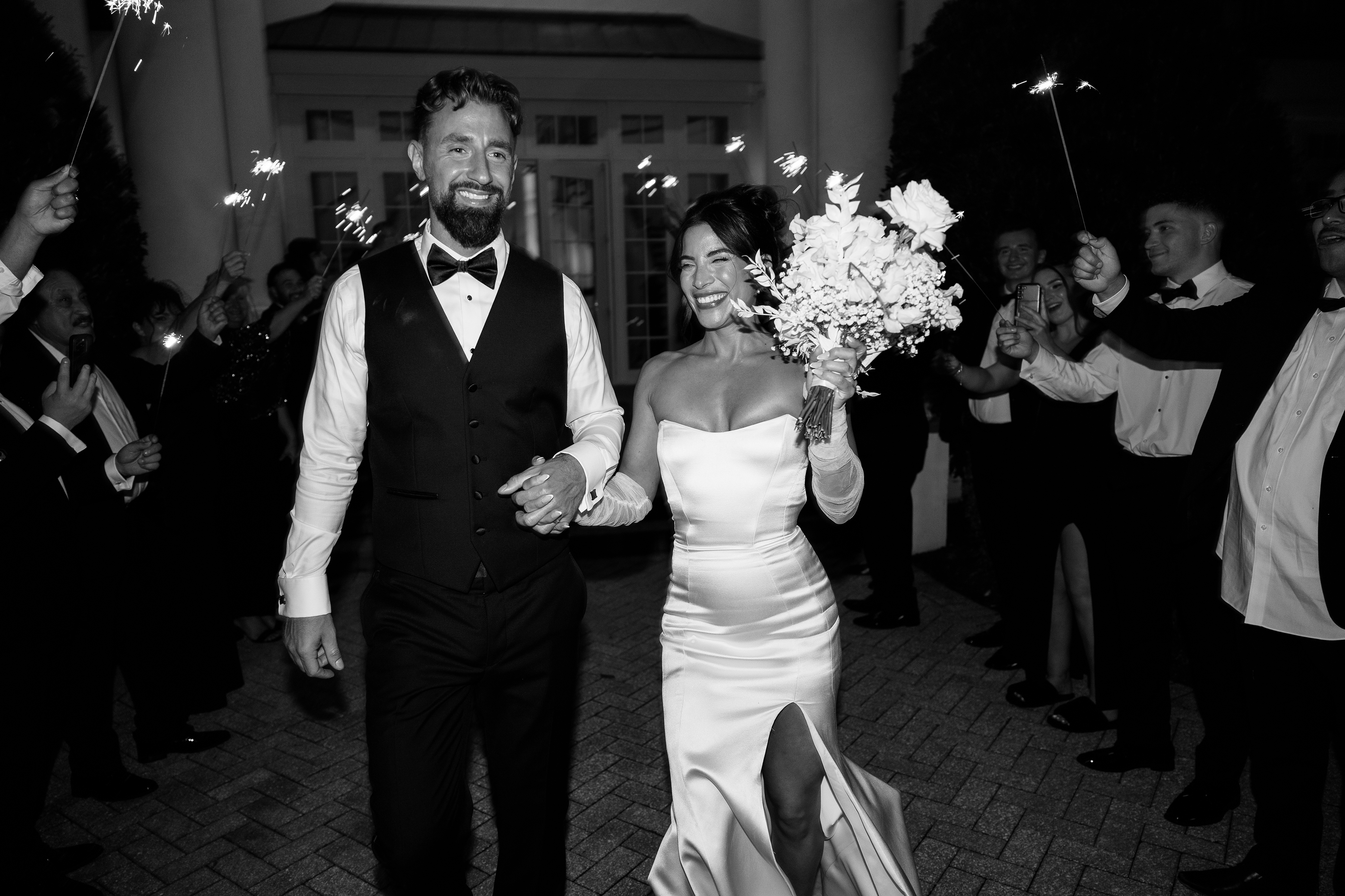 black and white picture of bride and groom's final exit