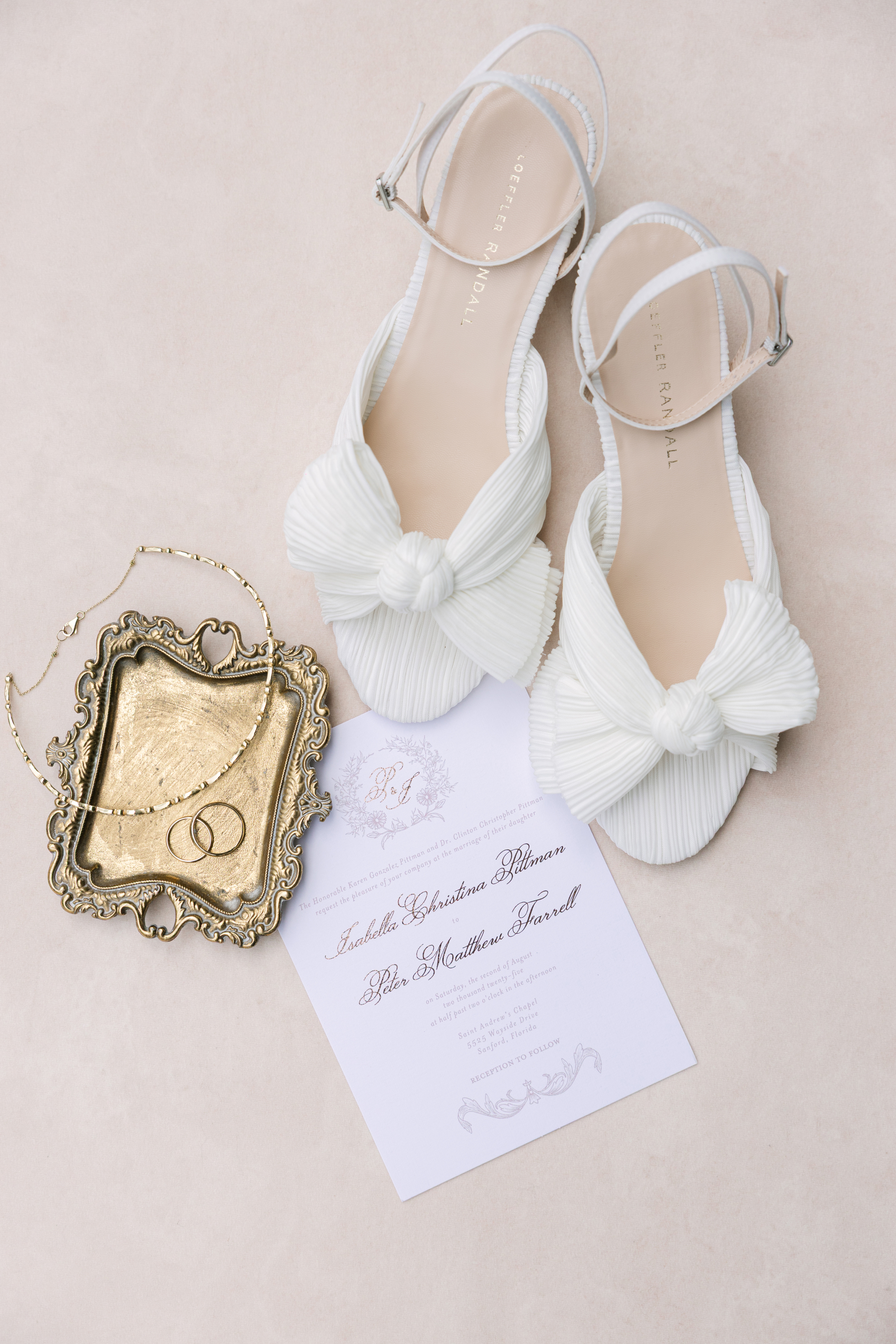 close-up bridal fashion detail with wedding stationary