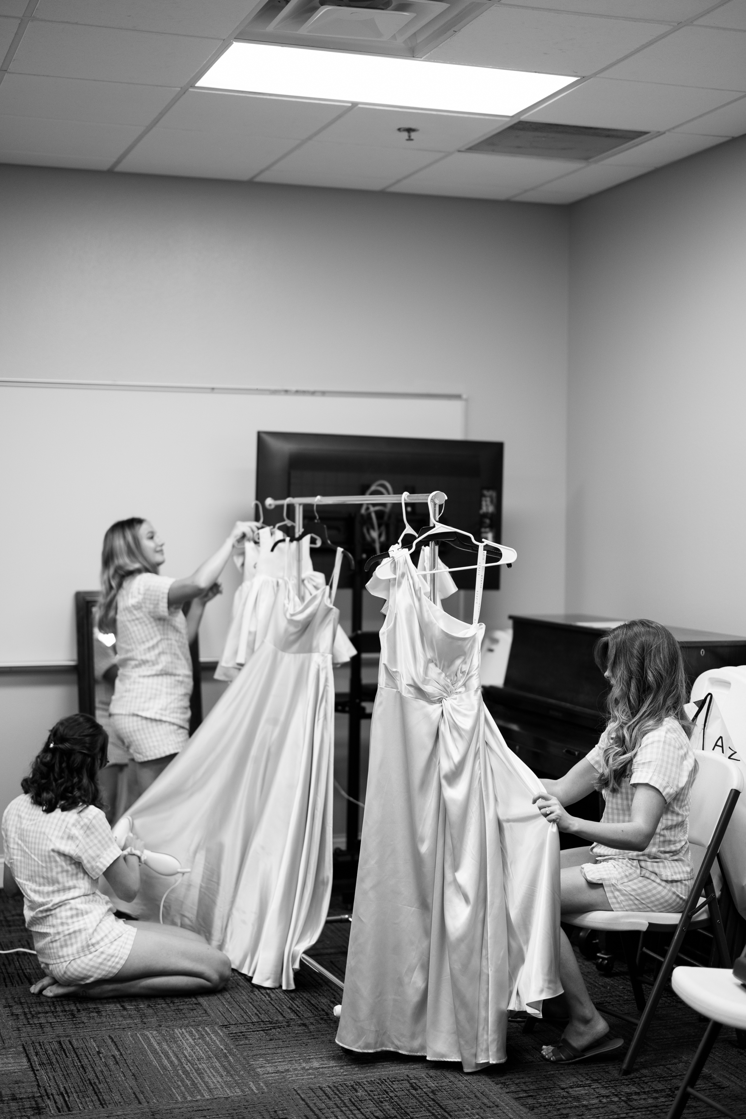 black and white portrait of bridesmaids getting ready for wedding