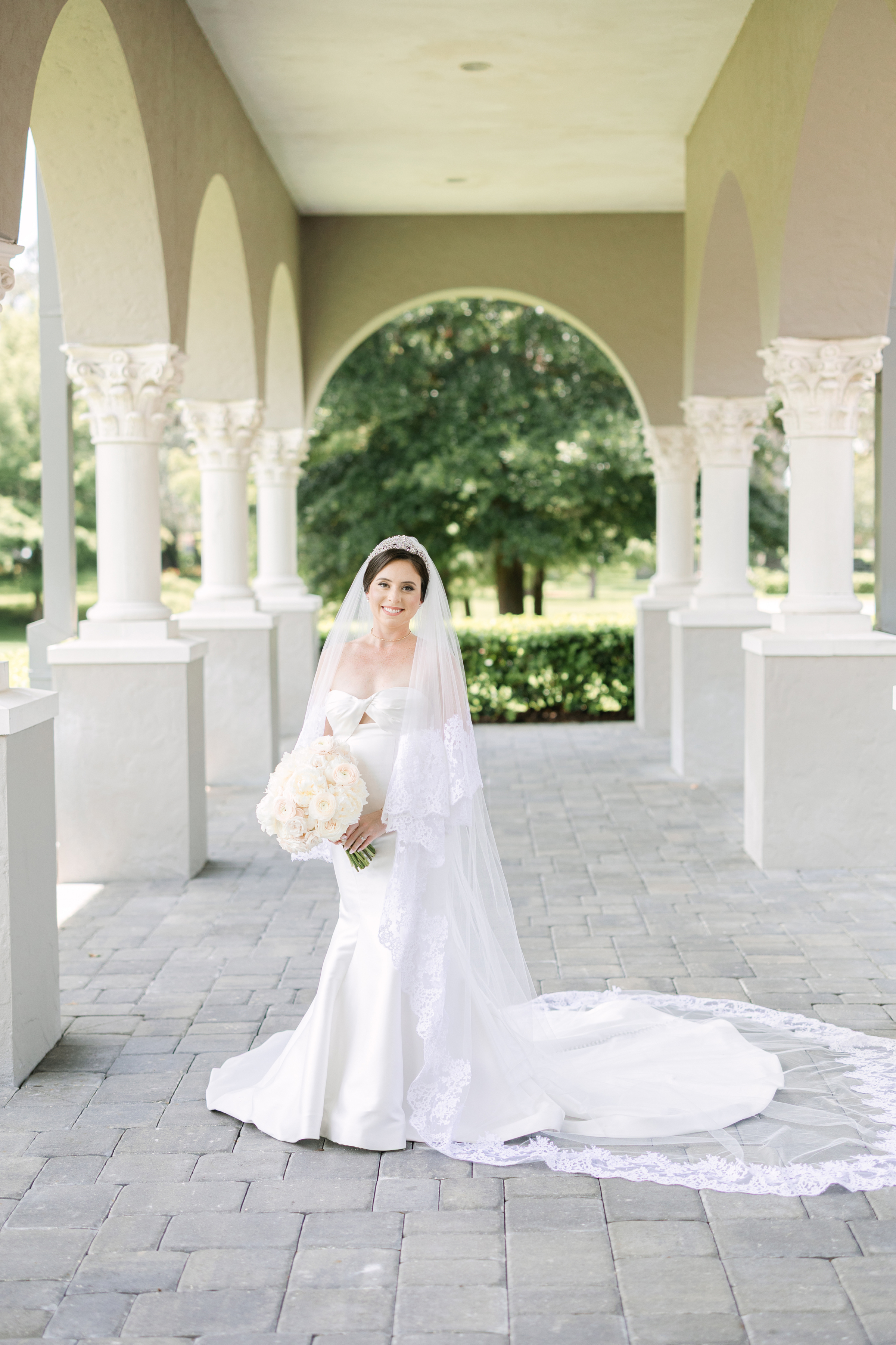 wedding portrait of bride with mermaid wedding dress and lace veil