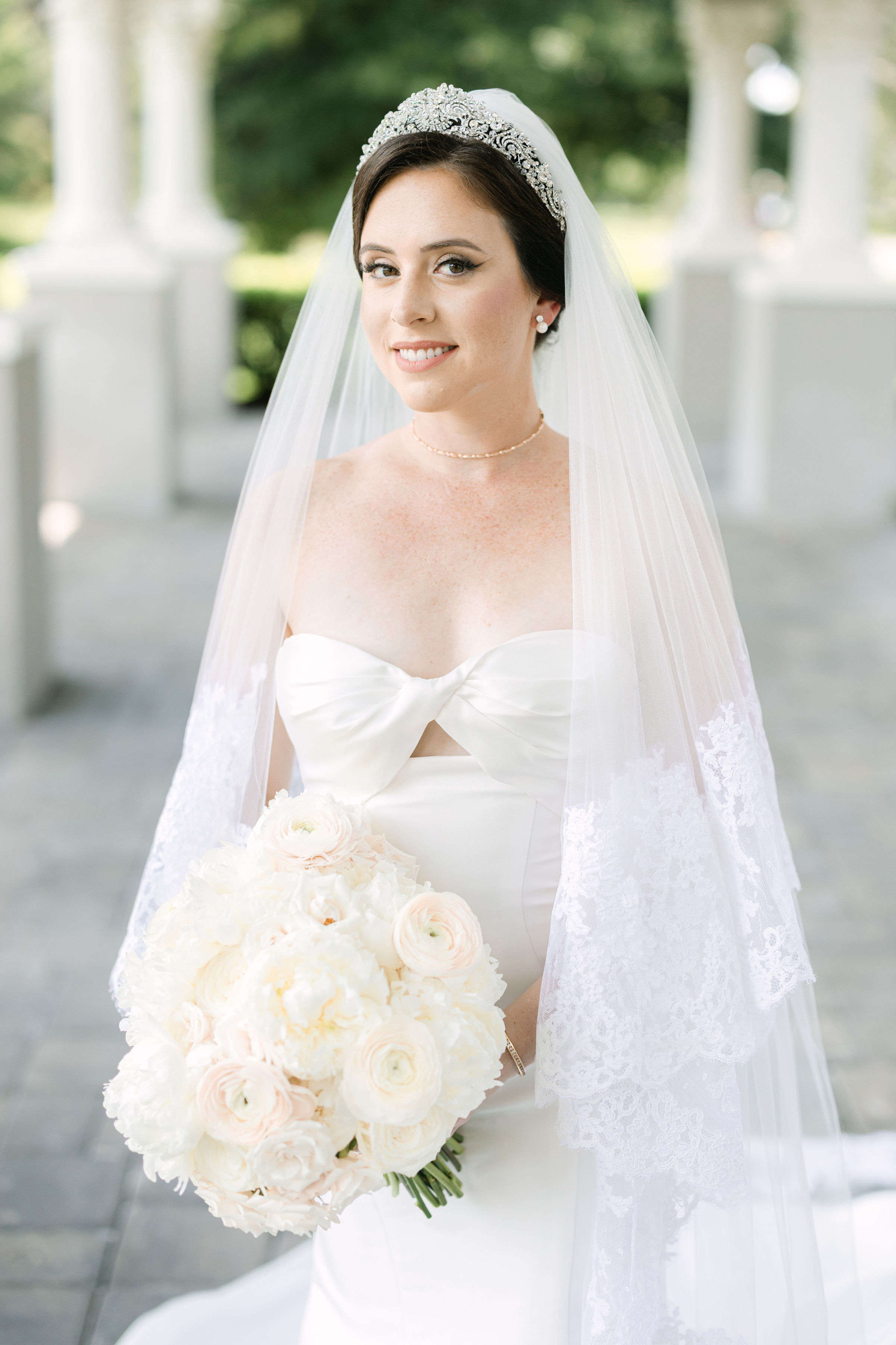 wedding portrait of bride with mermaid wedding dress and lace veil