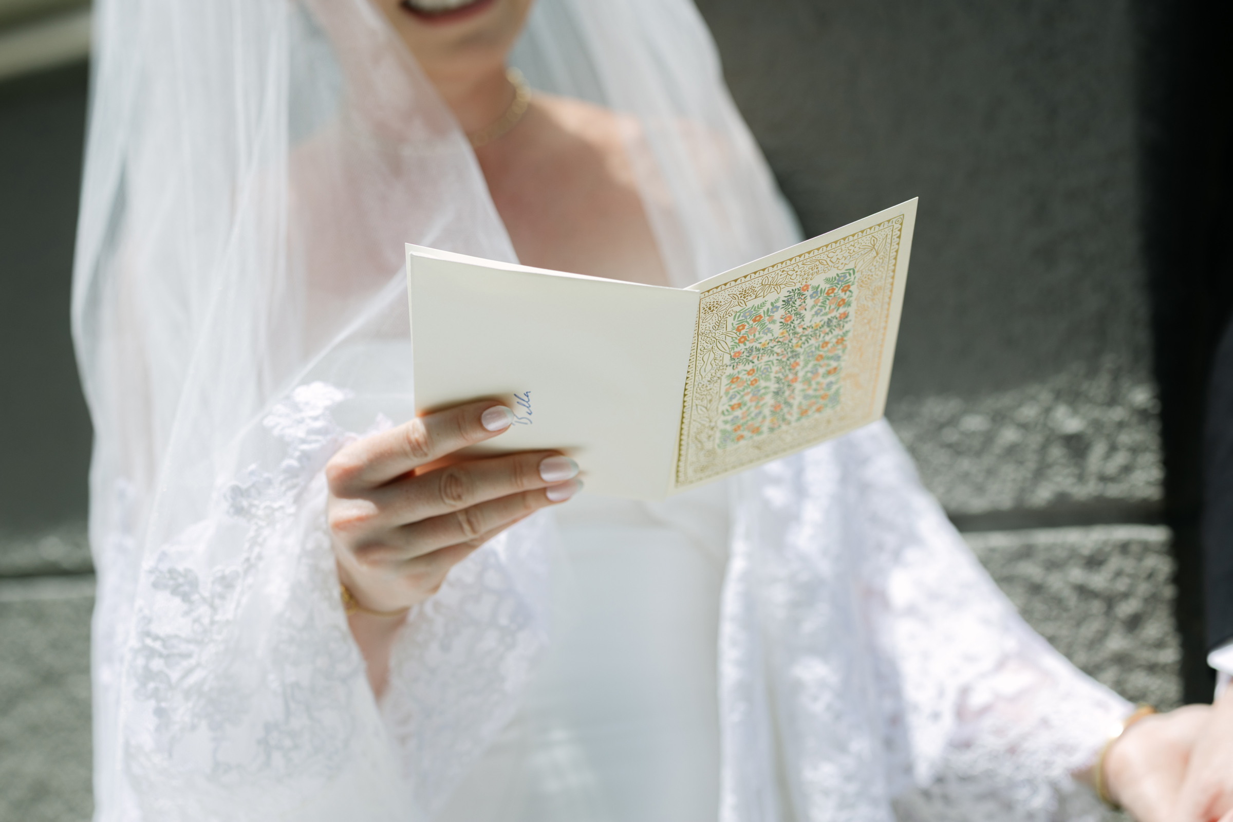 bride and groom reading each others vows during first look