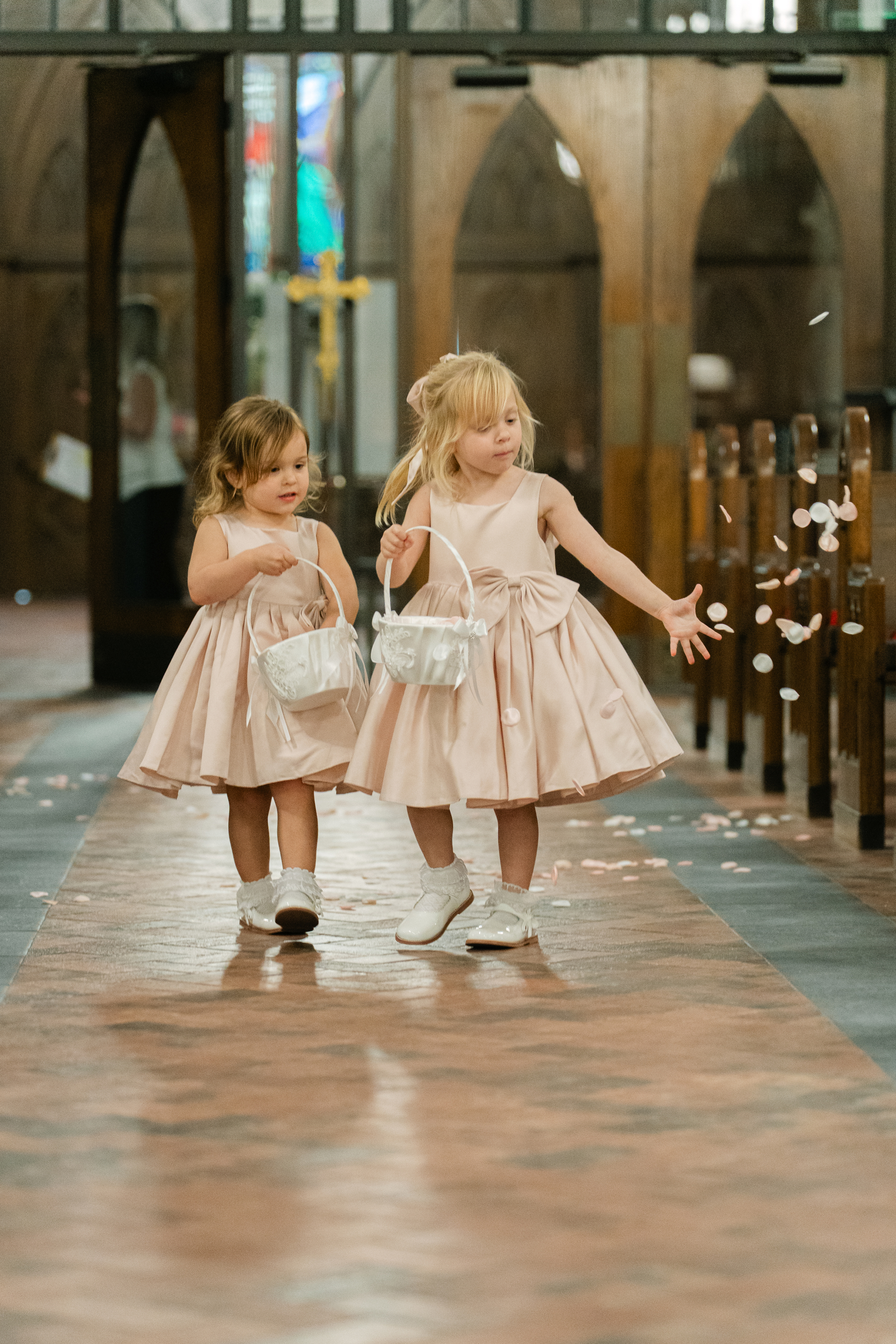 flower girls walking down the aisle