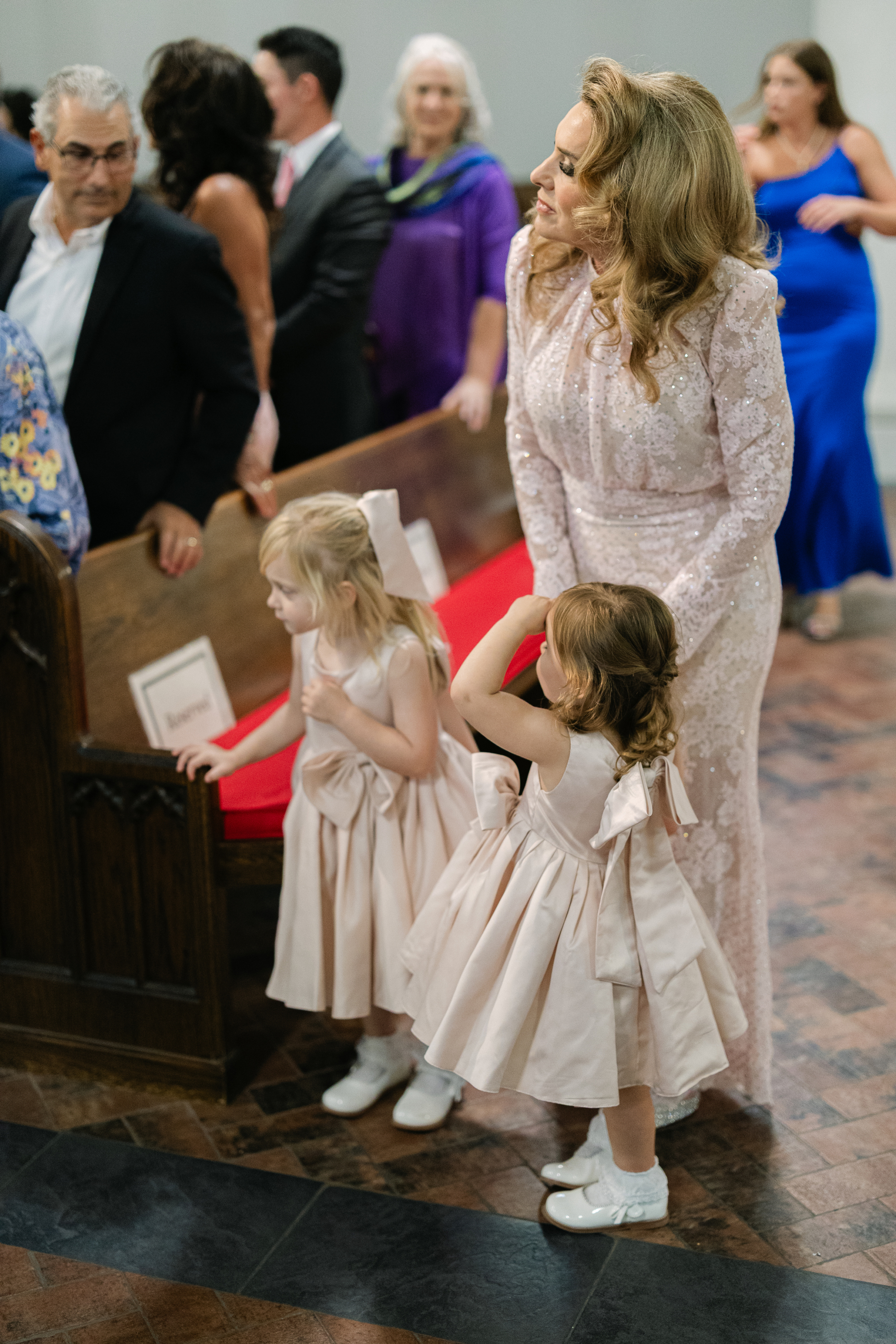 wedding guests standing up for the bride to walk down the aisle