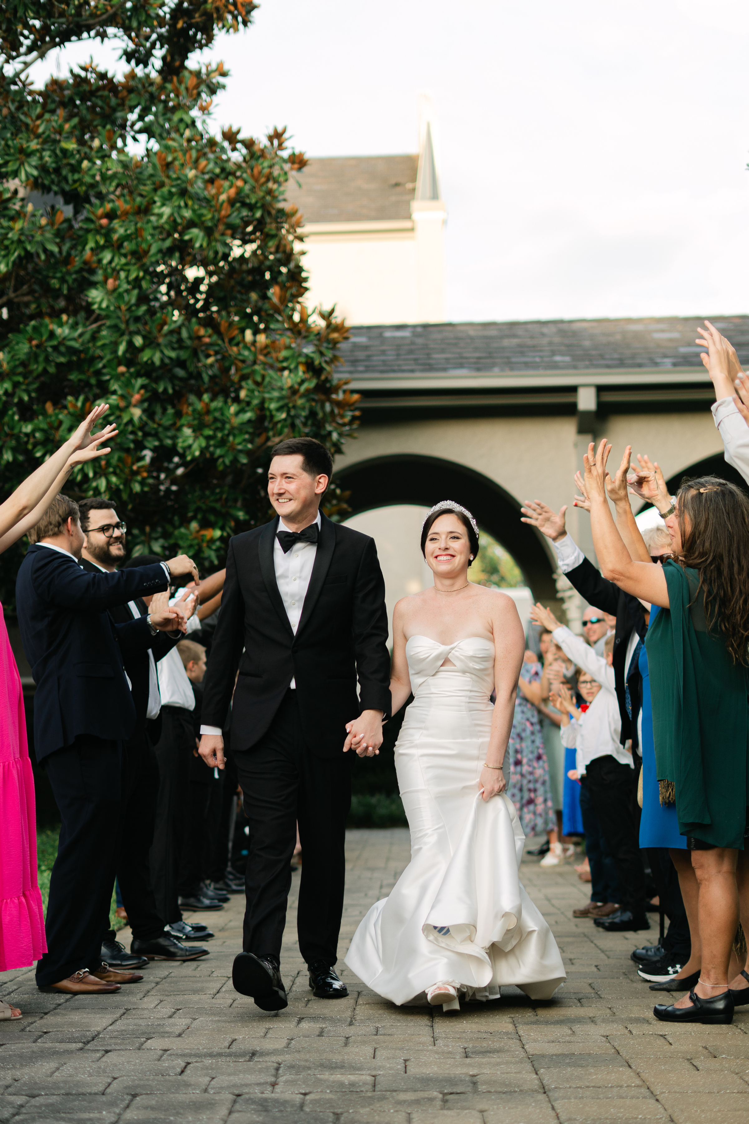 bride and groom making grand exit out of wedding reception