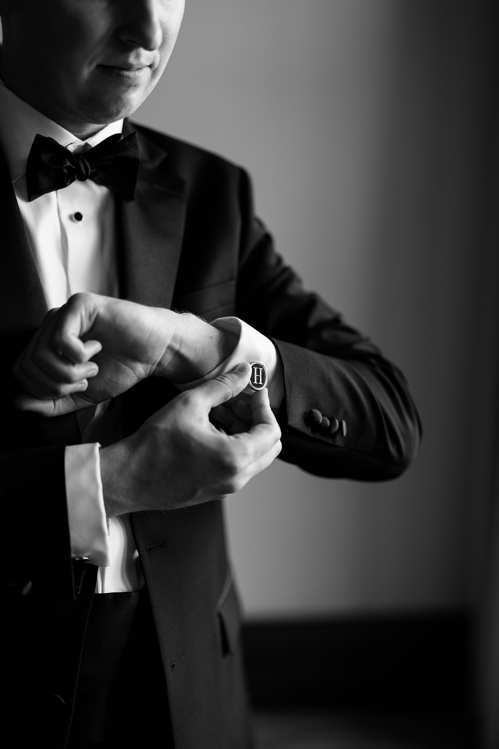 close up of groom's monogramed cufflinks