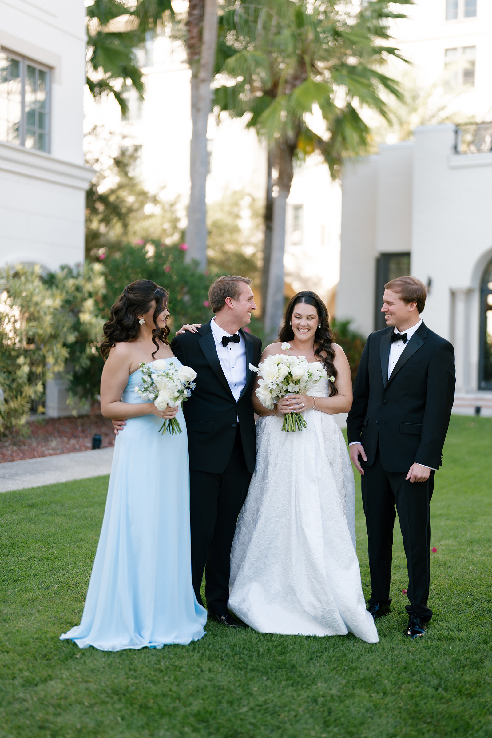 best man and maid of honor with bride and groom