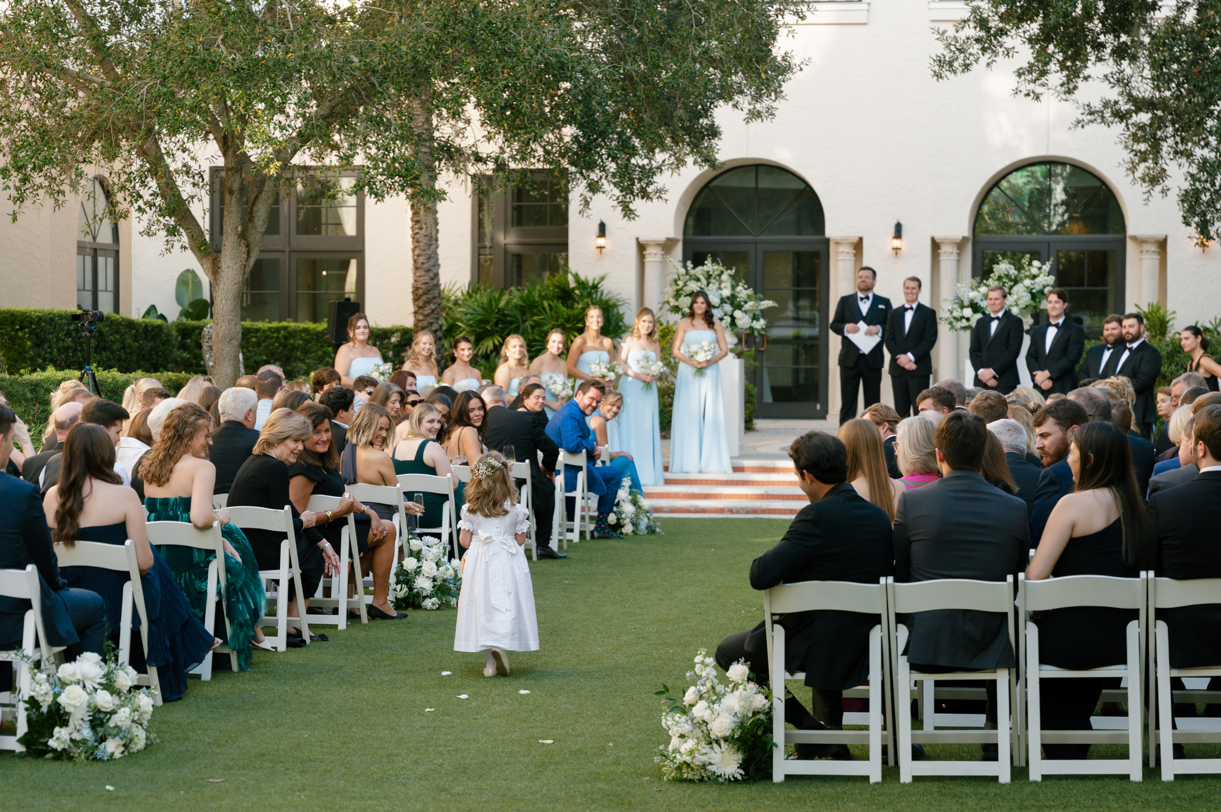 flower girl walking down the aisle