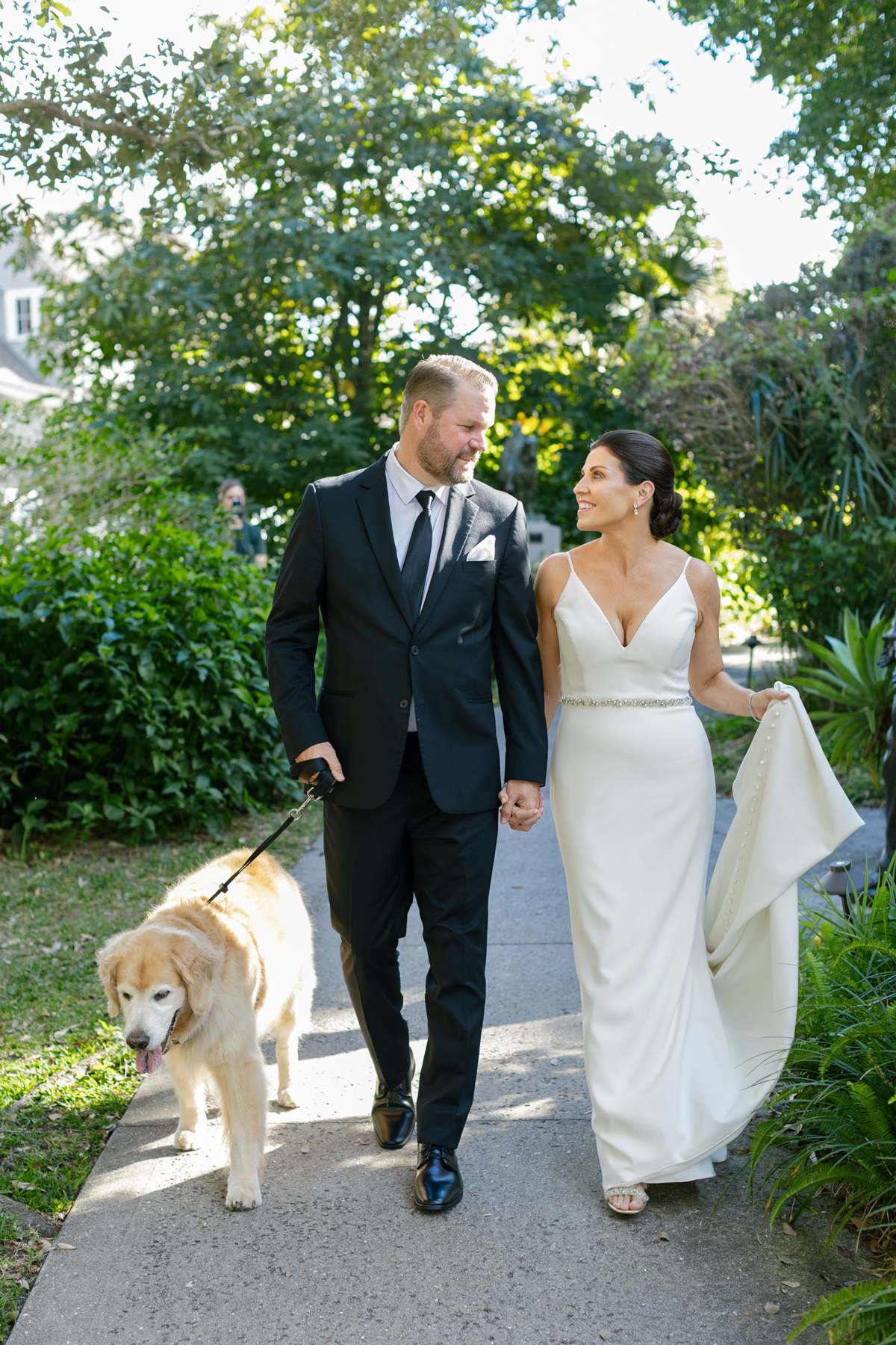 Bride and groom with golden retriever dog in Winter Park wedding