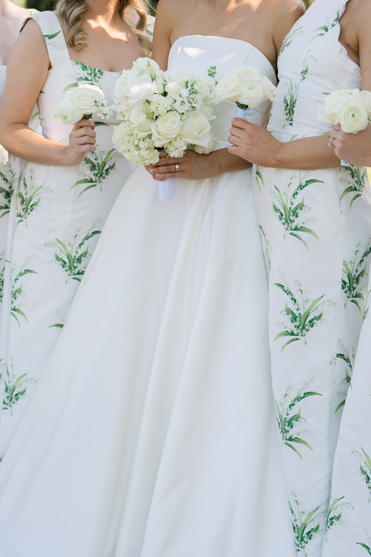 Preppy bridesmaids holding bouquets at Isleworth Country Club wedding venue