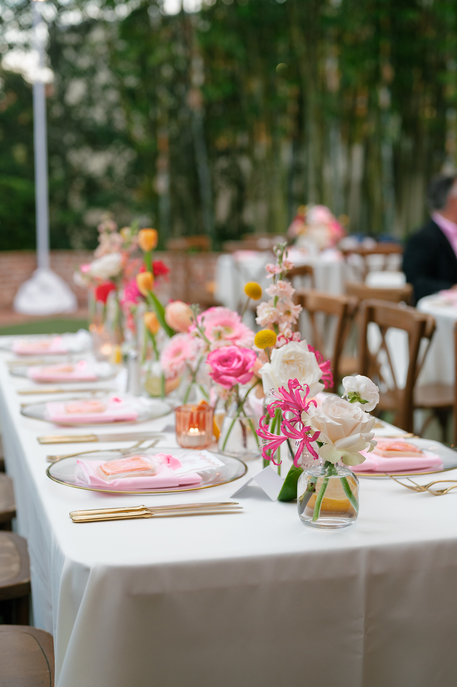 romantic garden-inspired florals with pink and orange personalized stationery at rehearsal dinner