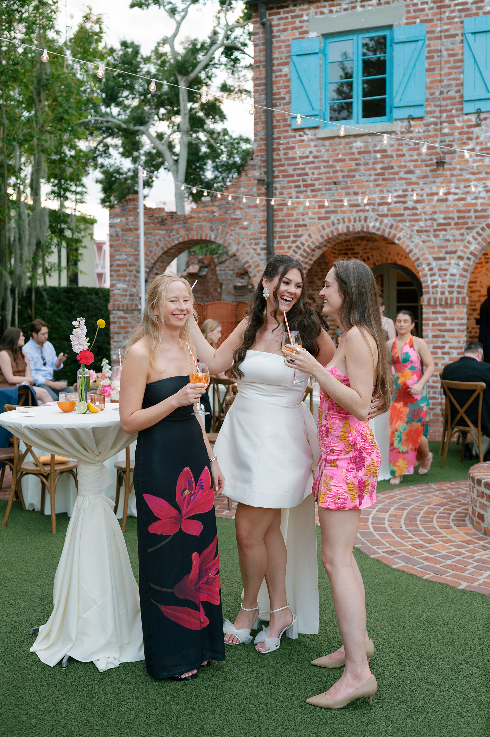 bride talking with guests during rehearsal dinner
