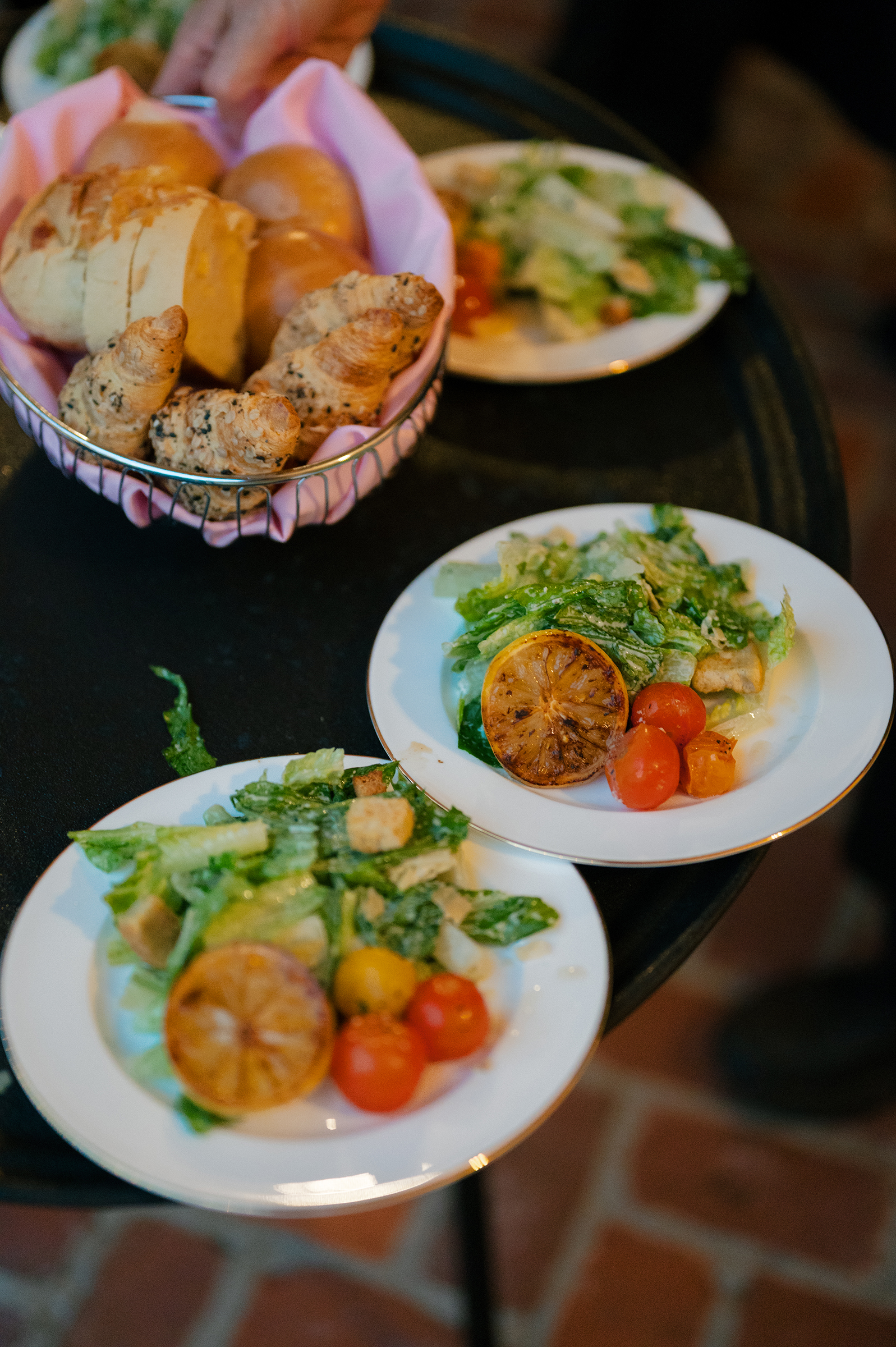caesar salads and bread