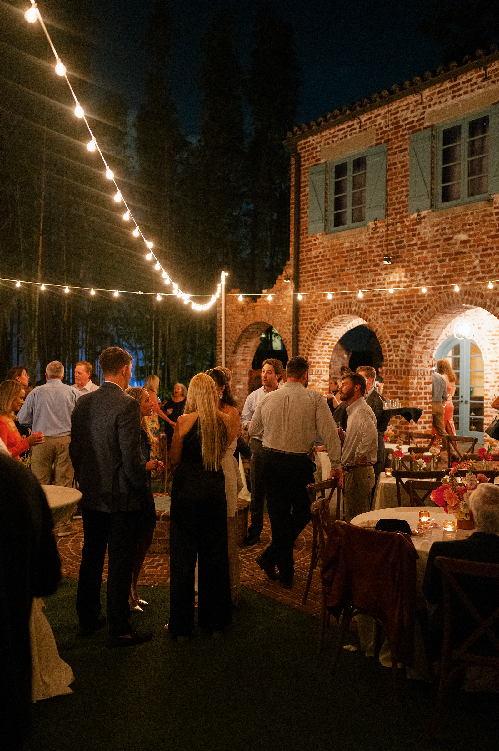 wedding guests outside of rehearsal dinner venue