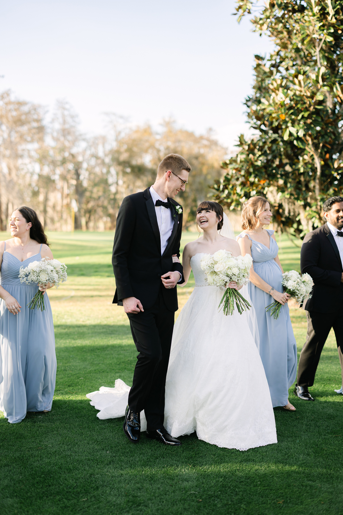 Newlyweds walking on golf course at Isleworth Country Club wedding venue