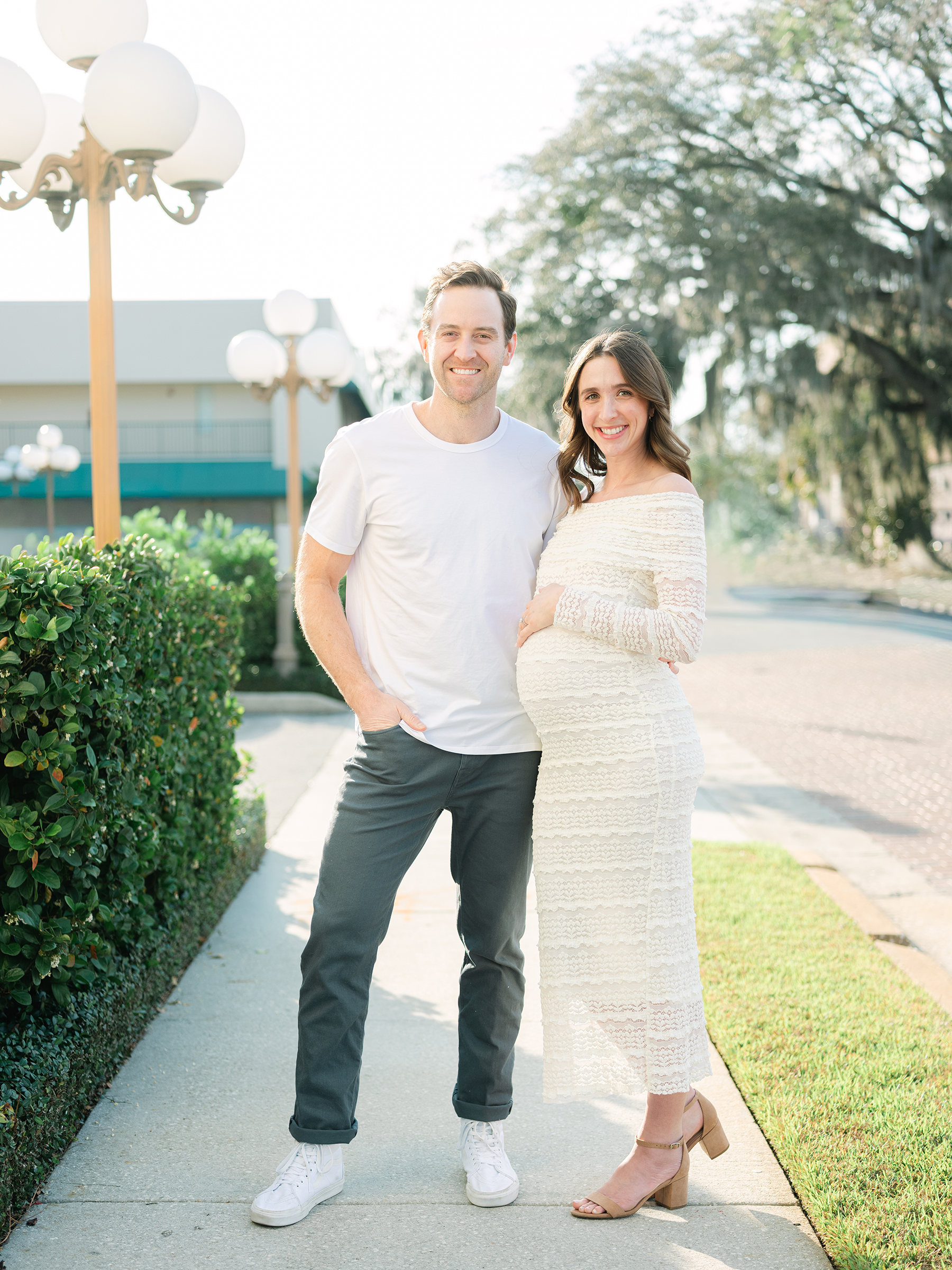 bright and clean maternity picture of husband and wife