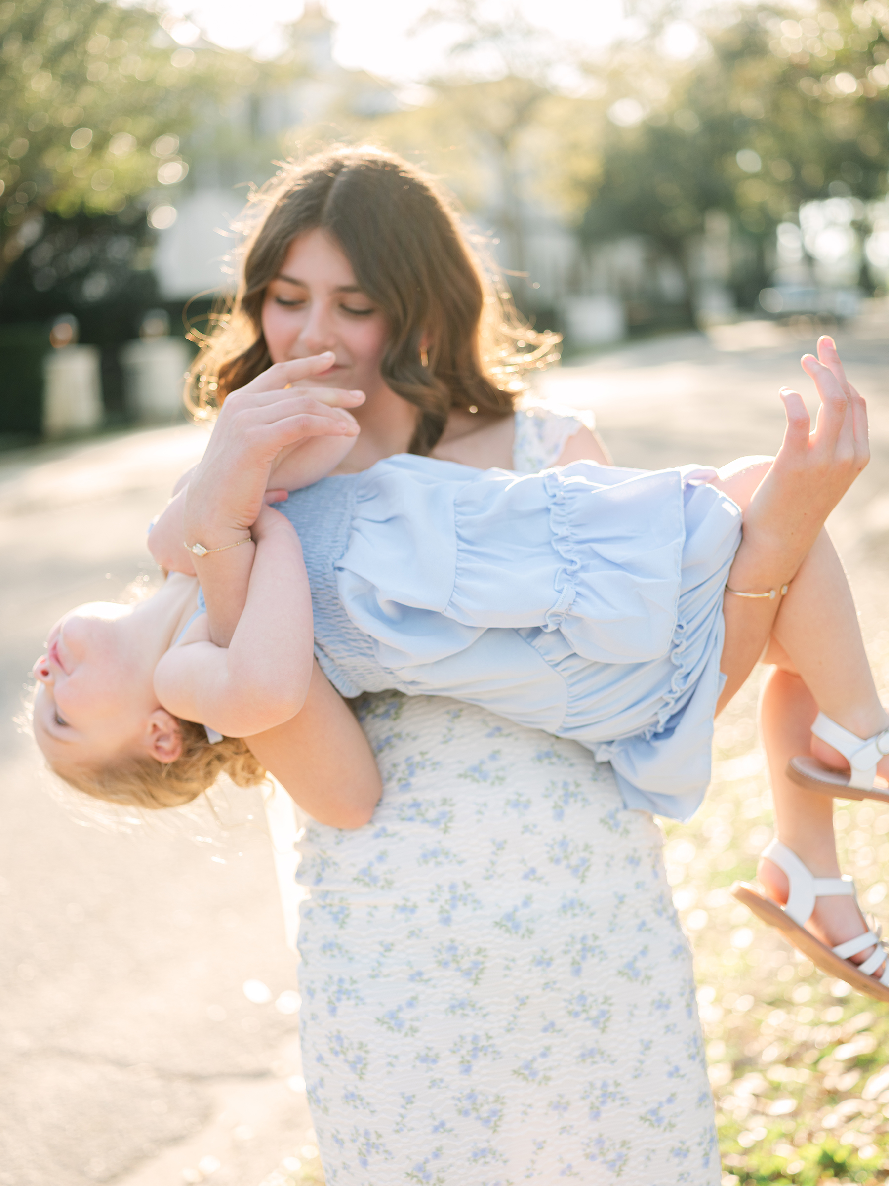 girl holding her little sister