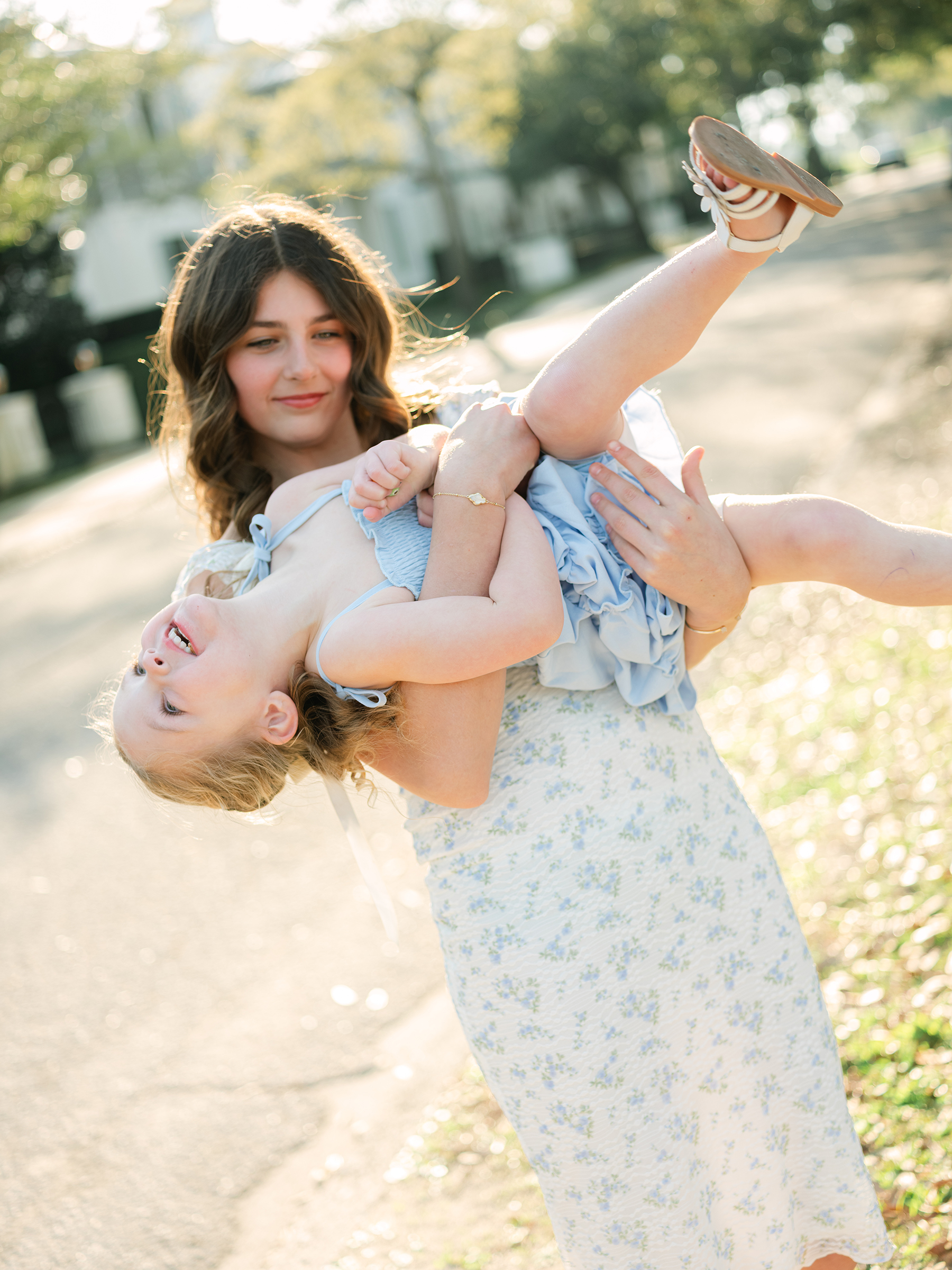girl holding her little sister