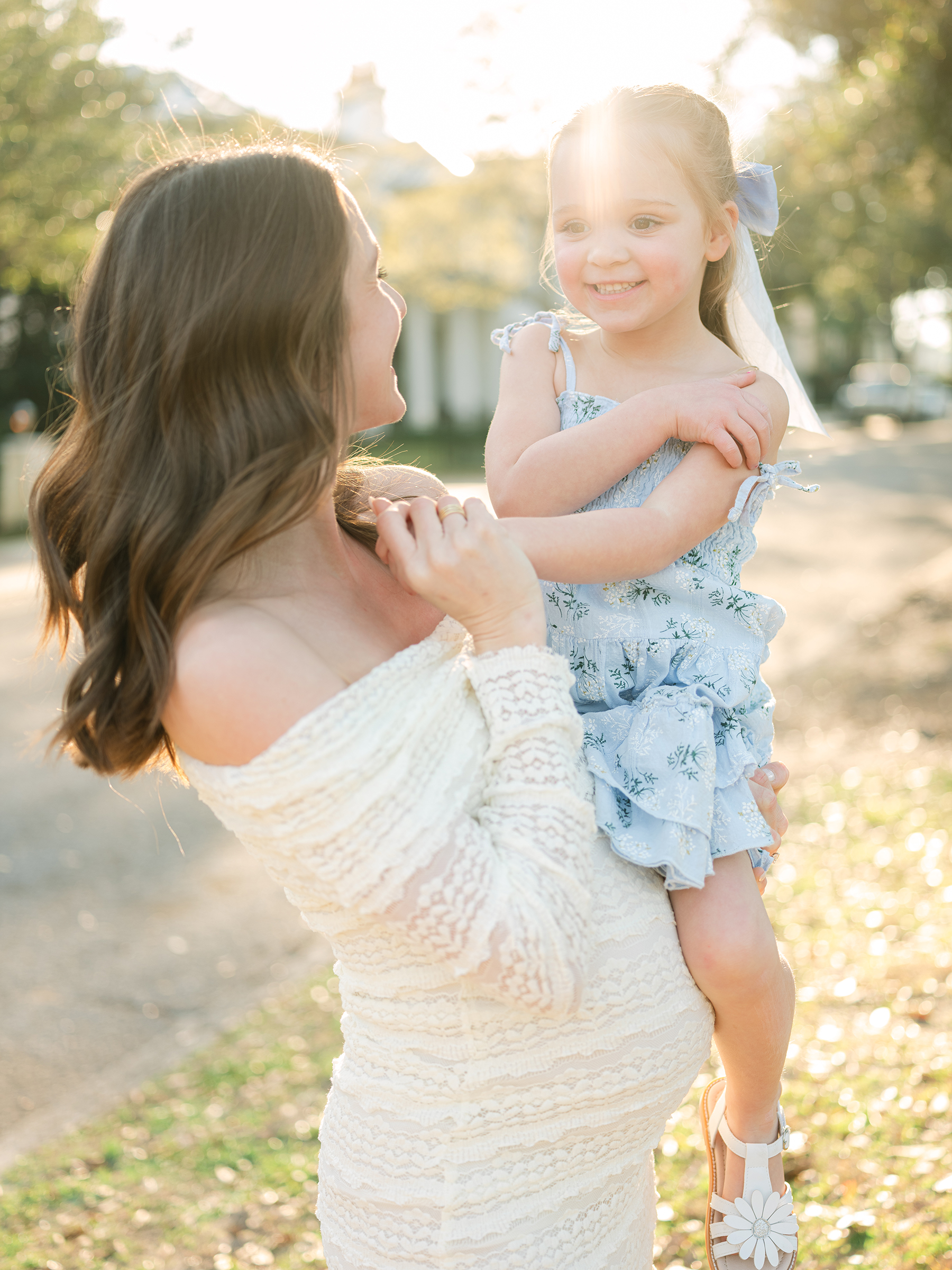sunlit and bright maternity photo with daughter