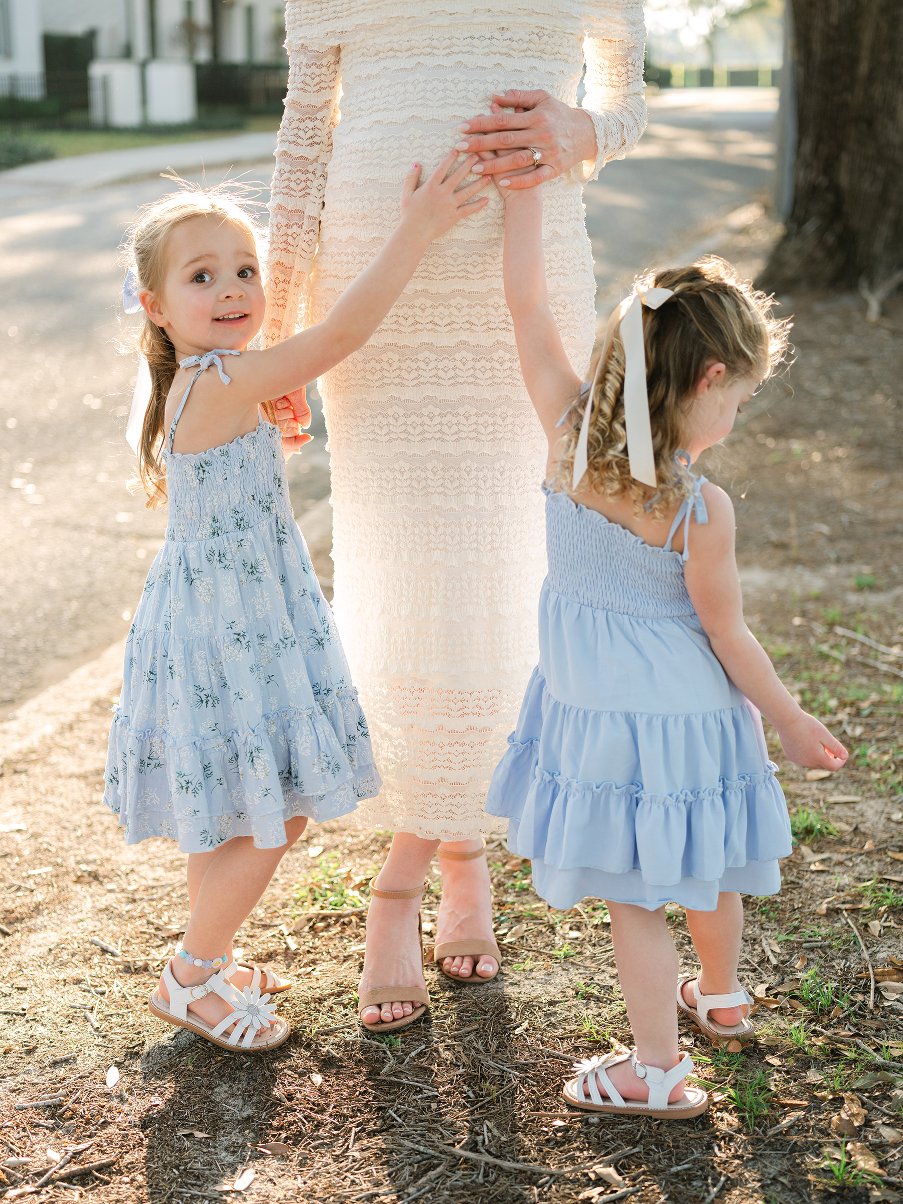 sunlit and bright maternity photo with daughters